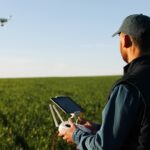 Farmer flying a drone